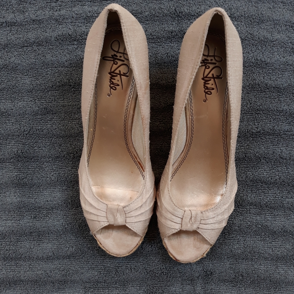 Women size 9.5 Tan wedges